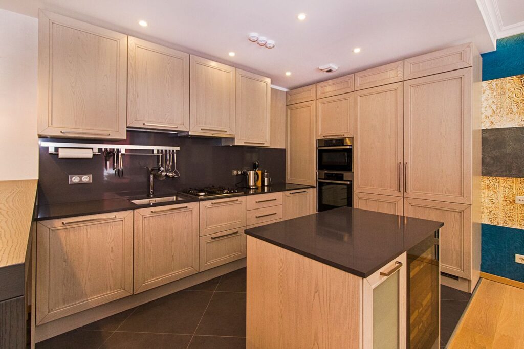 Contemporary kitchen with wooden cabinetry and a sleek island.